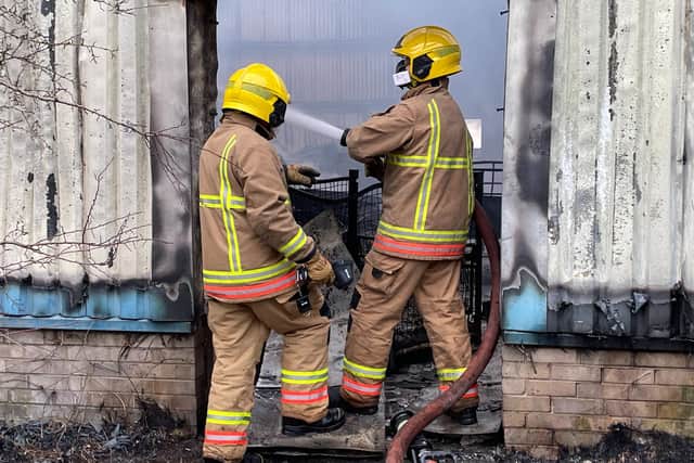 Firefighters tacking the blaze.

Photograph: TWFRS