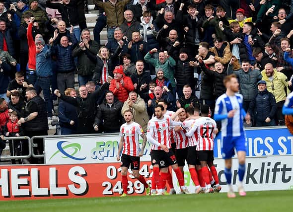 Sunderland players celebrate after scoring against Wigan. Picture by FRANK REID