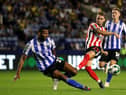 Sunderland's Jack Diamond (centre) has a shot on goal blocked by Sheffield Wednesday's Michael Ihiekwe during the Carabao Cup, first round match at Hillsborough.