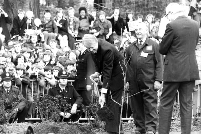 President Jimmy Carter plants a tree at Washington Old Hall in 1977, while Britain's Prime Minister, James Callaghan, looks on.