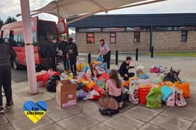 Pupils loading the school minibus with some of the donated items.