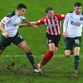 Sunderland player Jack Diamond is beaten to the ball by Plymouth players Kelland Watts (l) and Danny Mayor (r) during the Sky Bet League One match between Sunderland and Plymouth Argyle. (Photo by Stu Forster/Getty Images)
