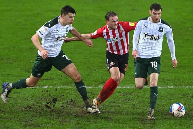 Sunderland player Jack Diamond is beaten to the ball by Plymouth players Kelland Watts (l) and Danny Mayor (r) during the Sky Bet League One match between Sunderland and Plymouth Argyle. (Photo by Stu Forster/Getty Images)