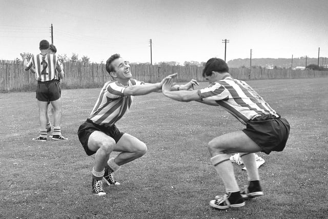 Sunderland players George Herd and Brian Clough have fun during training in 1965.