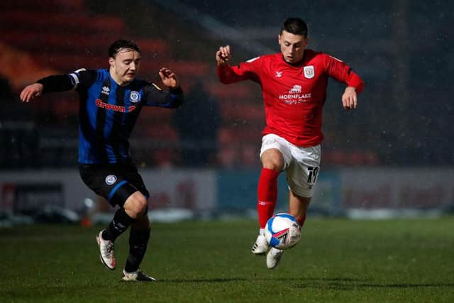 Owen Dale of Crewe Alexandra moves away from Ollie Rathbone of Rochdale.