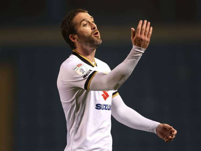 GILLINGHAM, ENGLAND - MARCH 02: Will Grigg of Milton Keynes Dons reacts during the Sky Bet League One match between Gillingham and Milton Keynes Dons at MEMS Priestfield Stadium on March 02, 2021 in Gillingham, England. Sporting stadiums around the UK remain under strict restrictions due to the Coronavirus Pandemic as Government social distancing laws prohibit fans inside venues resulting in games being played behind closed doors. (Photo by James Chance/Getty Images)