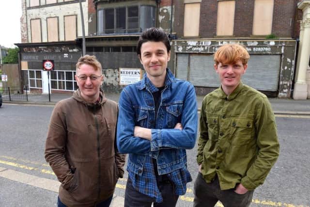 The buildings were in a poor state of repair when Pop Recs patron, singer James Bay, centre, visited in 2018. He's pictured here with Dave Harper and Michael McKnight from Pop Recs.