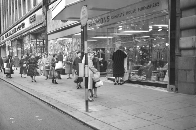 Shoppers in Fawcett Street. Woolworths and Simmons furniture shop are in the picture in this photo from 63 years ago.