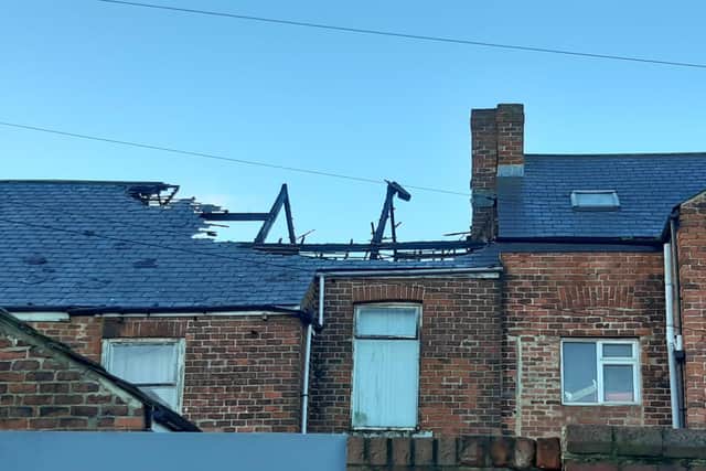 A roof was badly damaged by the blaze, which started in a neighbouring loft.