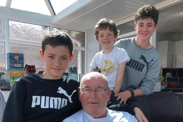 Sunderland fan Brian Payne with his three grandchildren, Taylor, Elliot and Jude