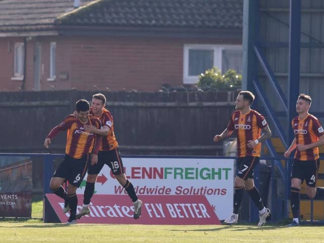 Anthony O'Connor of Bradford City celebrates with teammate Elliot Watt. (Photo by Henry Browne/Getty Images)