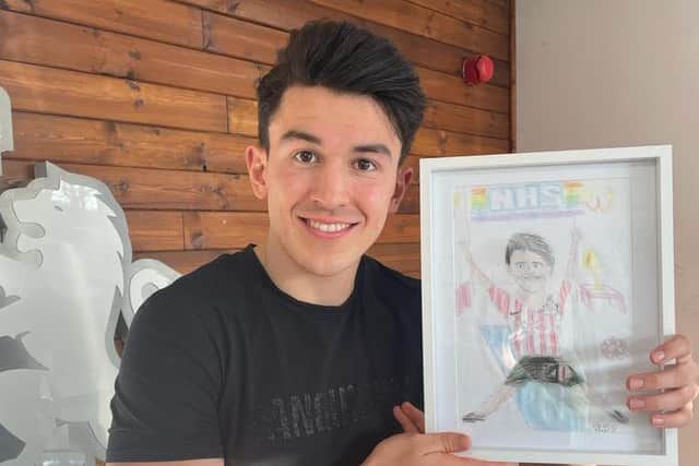 Luke O'Nien pictured with the drawing.