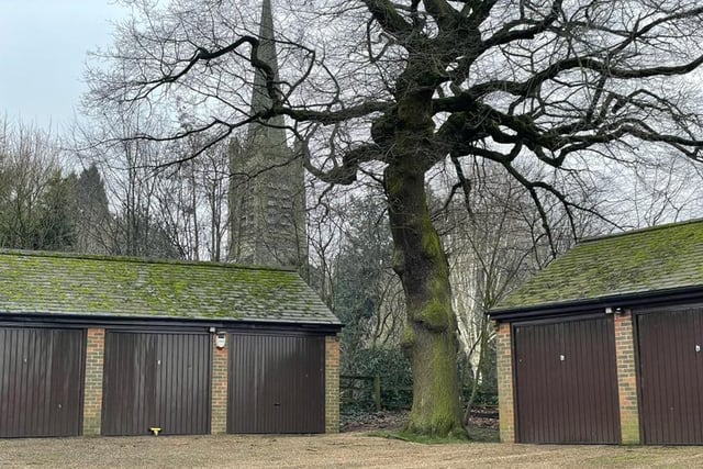 With trees and the village church in the background, this pictures gives an idea of the rustic setting for Park Mews.