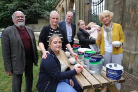 Creating the first stones for the new memorial garden at the Sunderland Fans Museum are Karen and Megan Matthews, Carol King and daughter Quinn, and committee member Dorothy Stewart, watched by SAFC legend Bobby Kerr (left) and Gentoo's John Ford