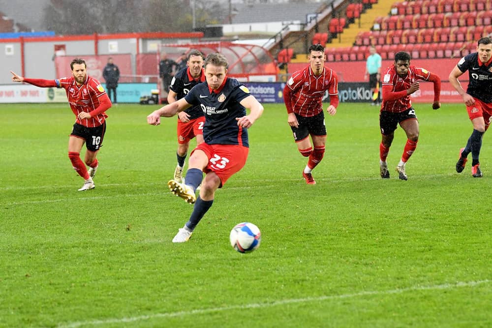Grant Leadbitter scores the opening goal at Sincil Bank