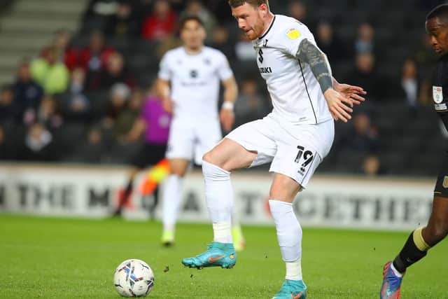 MILTON KEYNES, ENGLAND - APRIL 05: Connor Wickham of Milton Keynes Dons in action during the Sky Bet League One match between Milton Keynes Dons and Crewe Alexandra at Stadium mk on April 05, 2022 in Milton Keynes, England. (Photo by Pete Norton/Getty Images)