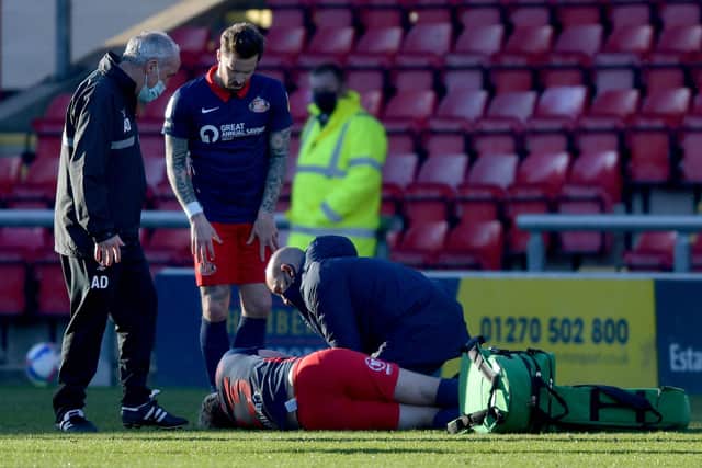 Crewe club doctor Austin Doherty, left, helped treat Sunderland midfielder Grant Leadbitter after he dislocated his shoulder during last weekend's 2-2 draw.