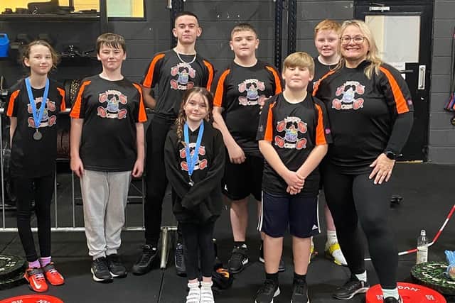 The successful young weightlifters from Weights & Cakes with coach Zoe Chandler.