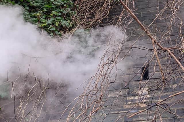 Smoke emerges from the wall