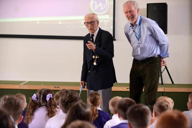 Hasting Hill Academy assembly hosted by 101 year old veteran Len Gibson with Daft as a Brush founder Brian Burnie.