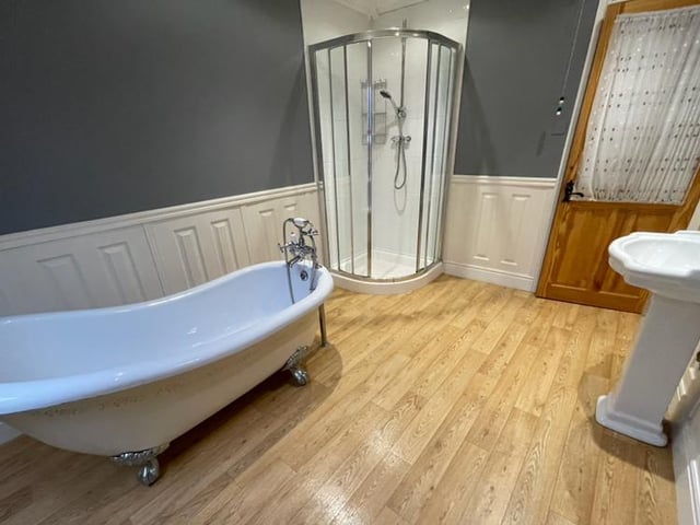 A second look at the family bathroom, showing a better view of the corner shower enclosure.