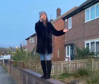 Deborah Taylor-Smith performing from her garden wall during the #clapforcarers celebration efforts in her Hebburn street.