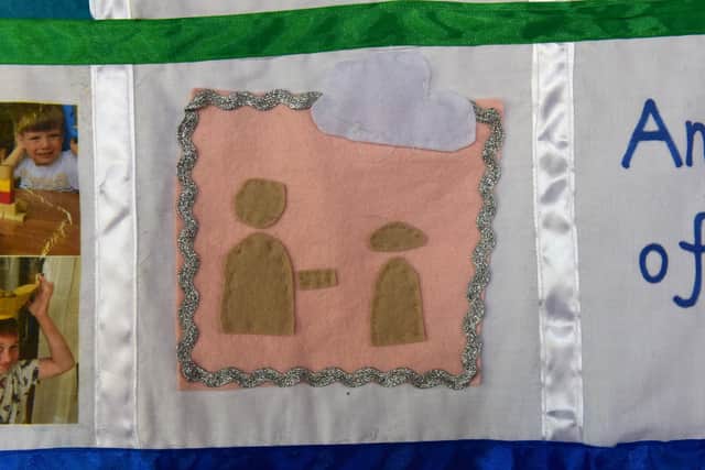Isabella Sloans's quilt patch showing people separated by the two metre rule.
