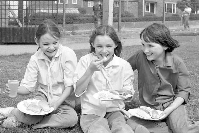 Cream cakes were the order of the day at Thorney Close Youth Club play scheme party in 1979 with these young girls 'tucking in'.  The girls (left to right) are twins Leslie and Fiona Gunn and Beverley Rowntree.