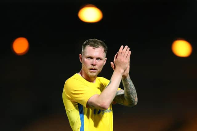 BURSLEM, ENGLAND - AUGUST 10: Aiden O'Brien of Sunderland applauds the fans following victory in the Carabao Cup First Round match between Port Vale and Sunderland at Vale Park on August 10, 2021 in Burslem, England. (Photo by Lewis Storey/Getty Images)