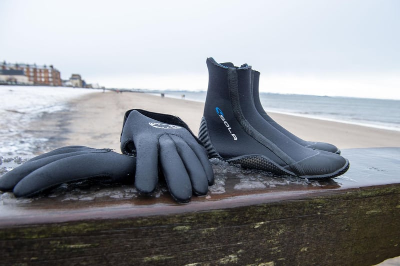 Neoprene gloves and booties help keen the cold out - along with the woolly bobble hats...