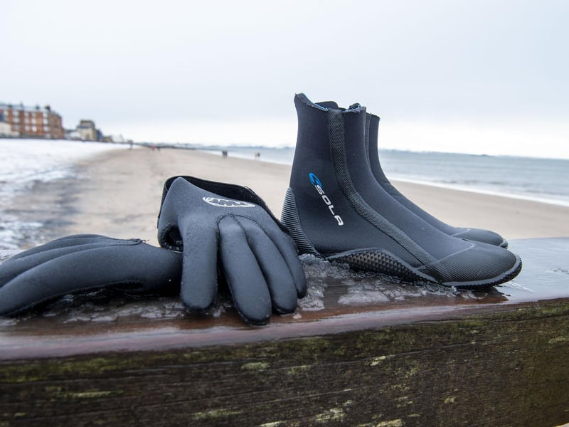 Neoprene gloves and booties help keen the cold out - along with the woolly bobble hats...