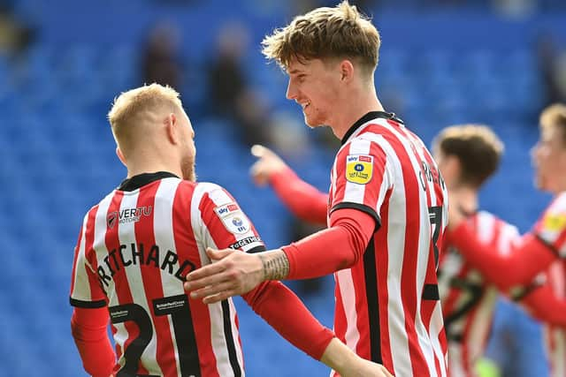 Alex Pritchard and Dennis Cirkin celebrate at the Cardiff City Stadium