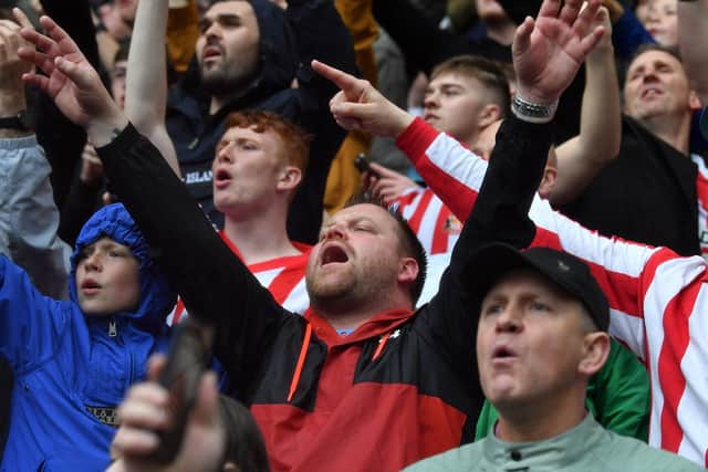 Sunderland fans celebrate their victory at Preston North End.