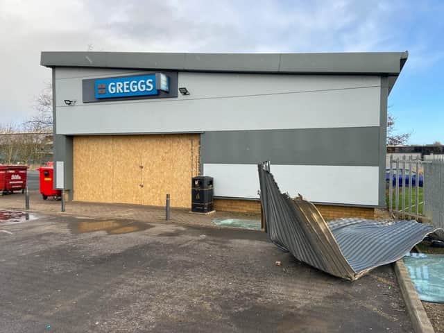 The front of the store has been boarded up./Photo: Frank Reid