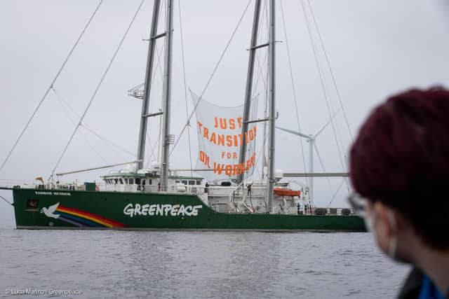 MY Rainbow Warrior with banner reading "Just Transition for Oil Workers" sails along an offshore wind farm.
Greenpeace UK is calling on the Scottish government to take action to deliver a just transition for oil and gas workers, or risk abandoning a whole workforce, as was seen with coal miners and shipbuilders in years gone by.