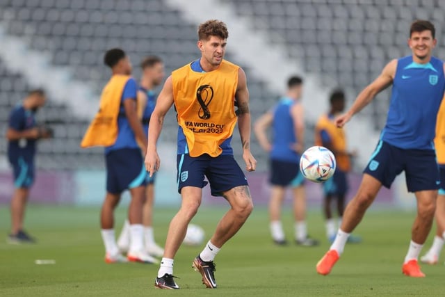 John Stones passes the ball during the England Training Session at Al Wakrah Stadium. (Photo by Alex Pantling/Getty Images).