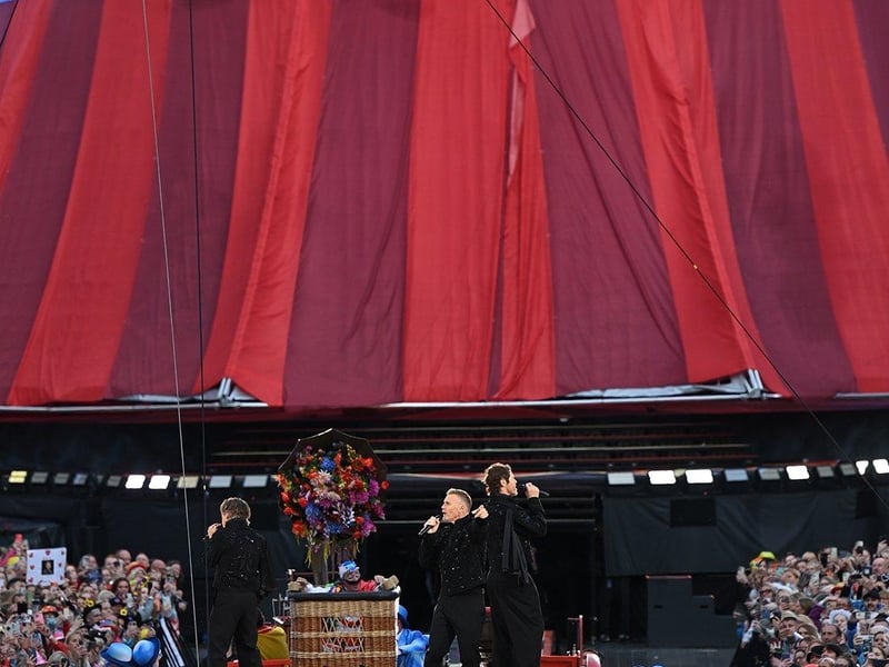 The trio perform in front of a delighted crowd.