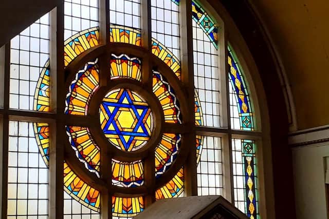 The stained glass windows at each end of the synagogue are magnificent. JPI image.