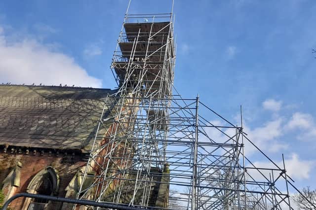 The scaffolding has been holding up the steeple for two years.