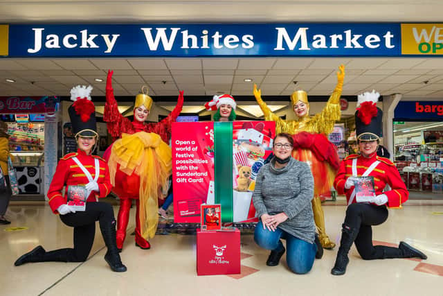 Cllr Claire Rowntree with Christmas characters outside Jacky Whites Market, Sunderland.