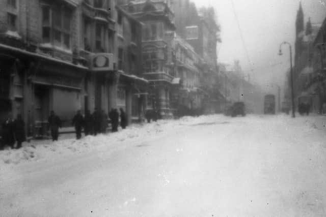 Sunderland went 18 days without daylight in 1947. This scene shows people braving a blizzard in Fawcett Street.