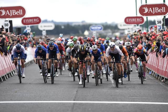 Team Jumbo-Visma Cycling's Wout Van Aert (centre) wins stage eight of the AJ Bell Tour of Britain from Stonehaven to Aberdeen. Picture date: Sunday September 12, 2021.