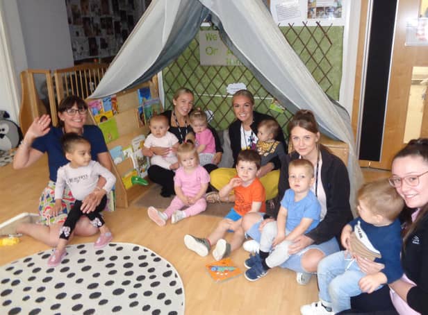 (left to right) Headteacher Claire Nicholson, Early Years Practitioners  Hannah Dobinson, Lucy Norman and Emma Harrison, alongside Early Years Assistant Caitlin Williams and children at the nursery.