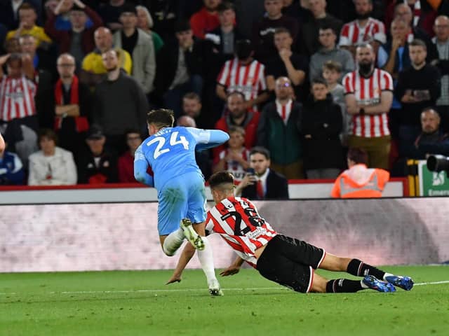 Dan Neil was shown a red card for a foul on James McAtee at Bramall Lane