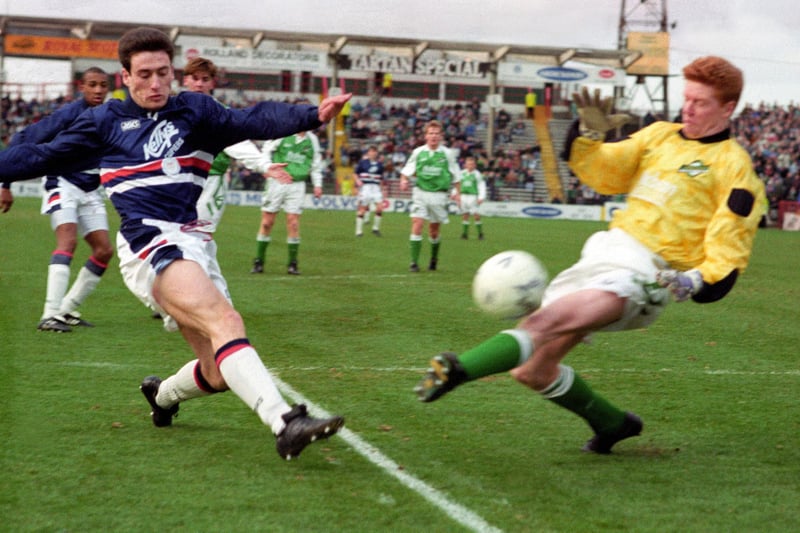 Stand-in 'keeper Graham Mitchell, in after Chris Reid had to be taken off, denies Dundee's John McQuillan - but the Dark Blue ran out 3-1 winners in this February 1993 encounter at Easter Road