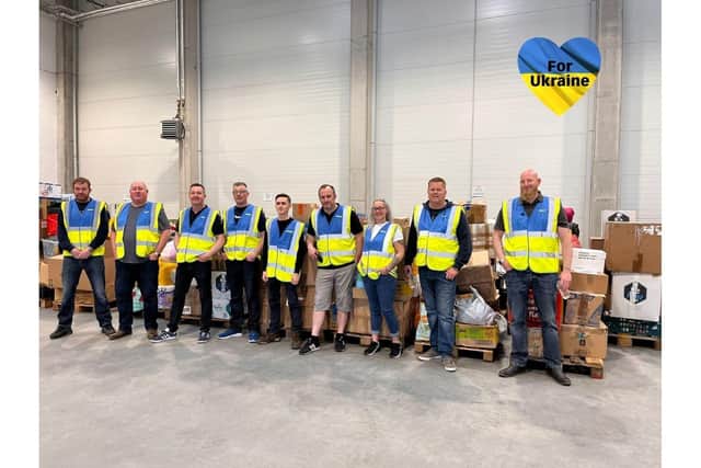 Lee and other members of the team at the warehouse where their donations of aid will be distributed from.