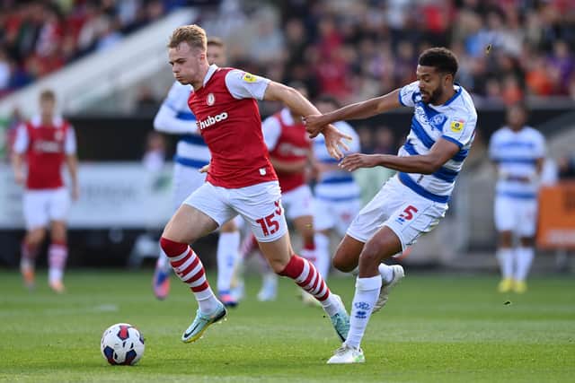 BRISTOL, ENGLAND - OCTOBER 01: Tommy Conway of Bristol City holds off Jake Clarke-Salter of Queens Park Rangers during the Sky Bet Championship between Bristol City and Queens Park Rangers at Ashton Gate on October 01, 2022 in Bristol, England. (Photo by Dan Mullan/Getty Images)