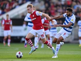 BRISTOL, ENGLAND - OCTOBER 01: Tommy Conway of Bristol City holds off Jake Clarke-Salter of Queens Park Rangers during the Sky Bet Championship between Bristol City and Queens Park Rangers at Ashton Gate on October 01, 2022 in Bristol, England. (Photo by Dan Mullan/Getty Images)