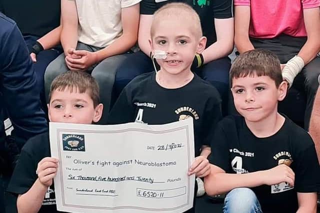 Oliver with brothers Oscar and Owen at Sunderland East End A.B.C who raised over £6,500 for him.