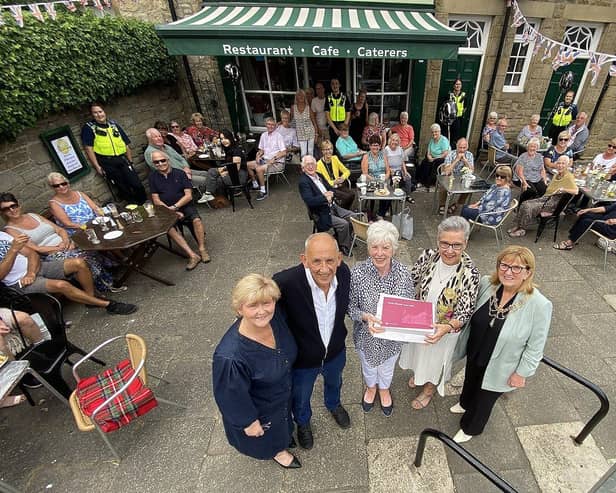 The Mayor of South Tyneside Councillor Pat Hay (2nd right) presents a gift to Fran and Peter Hooper from the Village Cafe, Whitburn to mark their 50th year in business. As The Mayoress Mrs Jean Copp (right) and the Leader of South Tyneside Council Councillor Tracey Dixon look on. Also photographed are members of the public who called at the cafe to congratulate Fran and Peter. Picture by FRANK REID